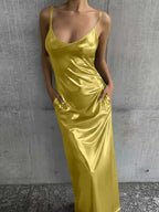 Textured mirror-finish U-neck slip maxi dress with pockets from FitiqueFit, casualwear style, shown hanging on a neutral background.
