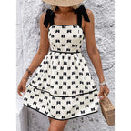 FitiqueFit tie-strap mini dress with smocked bodice and A-line silhouette, perfect for casual summer wear.