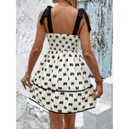 FitiqueFit tie strap mini dress with smocked bodice and A-line silhouette, perfect for casual summer wear.