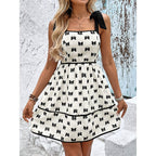 Light blue smocked tie-strap mini dress by FitiqueFit featuring a casual A-line silhouette and summer-inspired design.