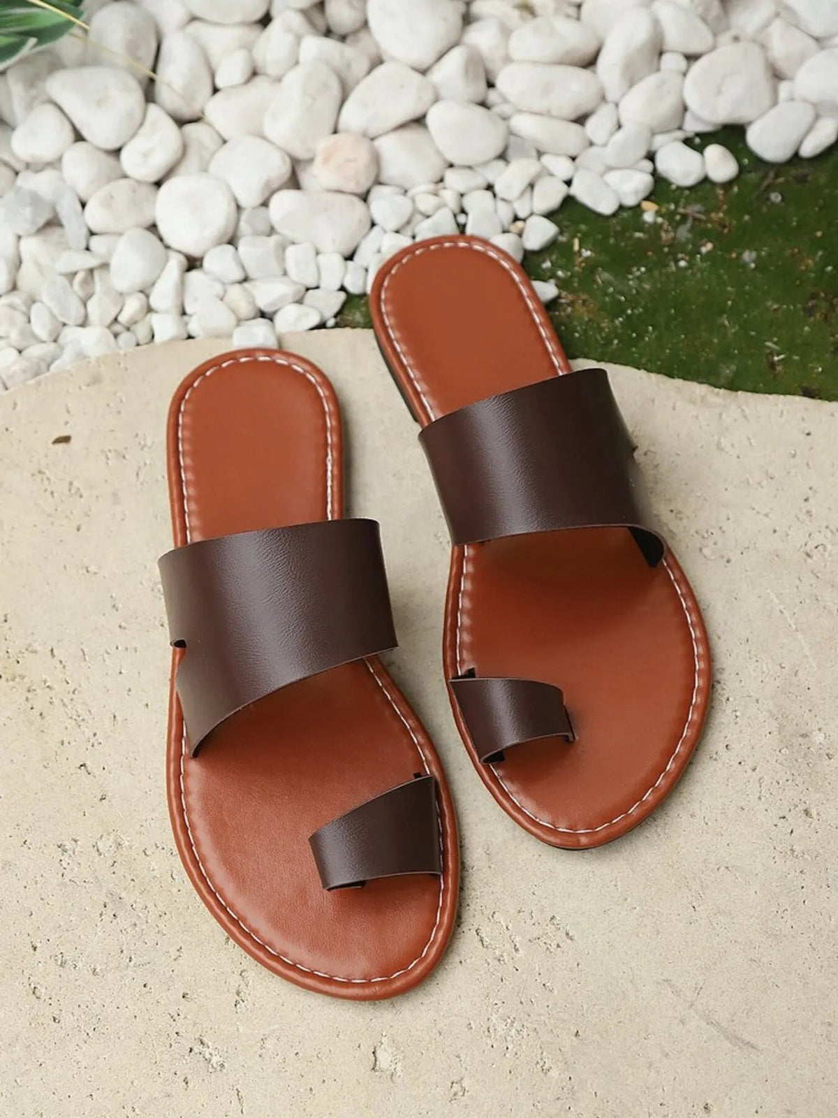 Women's vegan PU leather toe-loop flat sandals by Plush Fashion Hub, featuring comfortable everyday wear design with stylish simplicity.