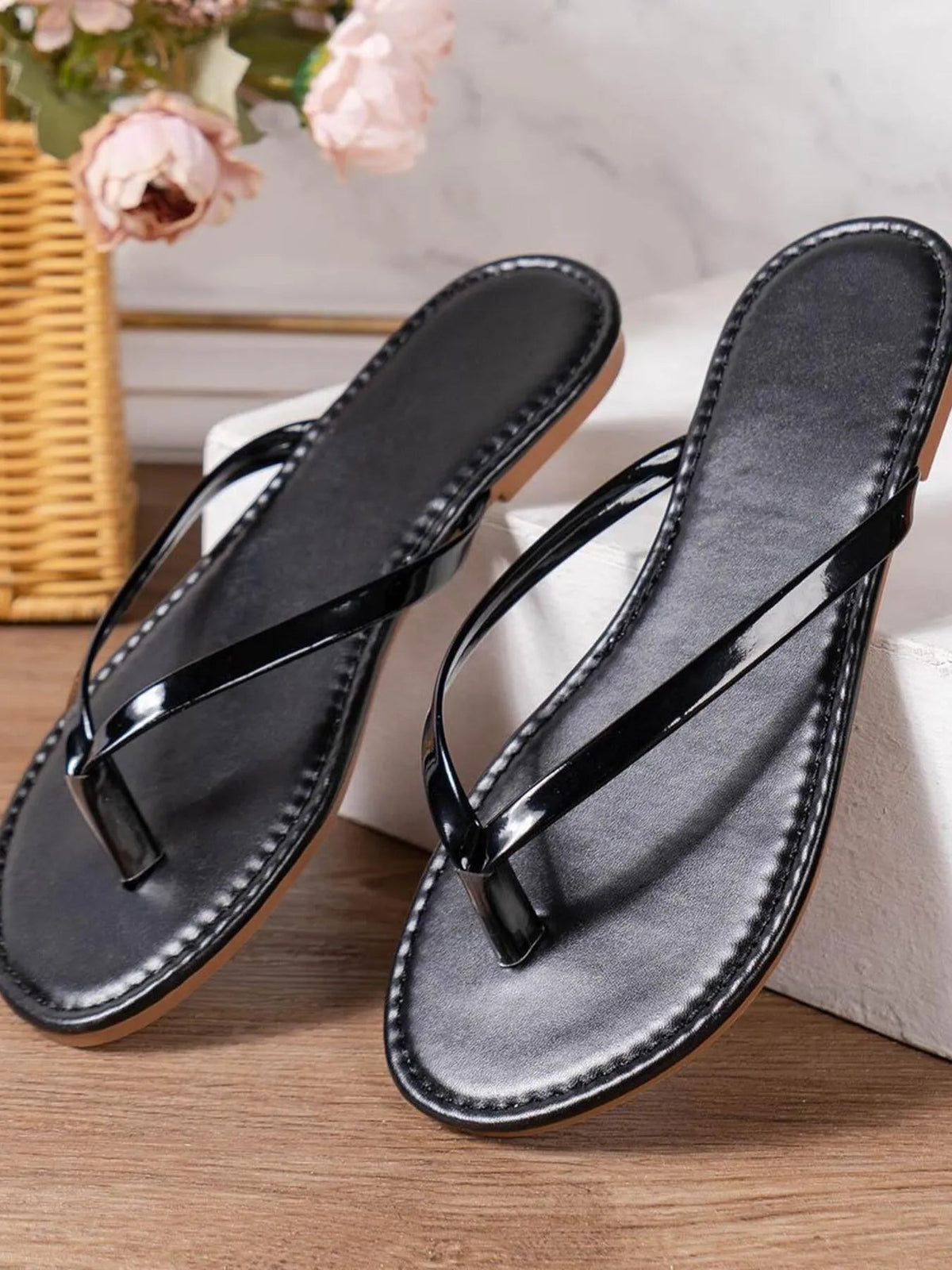 Women's PU leather toe post flat sandals by Plush Fashion Hub, featuring a sleek design and comfortable flat sole.