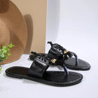 Women's PU leather toe-post flat sandals with minimalist design, perfect for summer, featuring comfortable slip-on style and neutral tones.