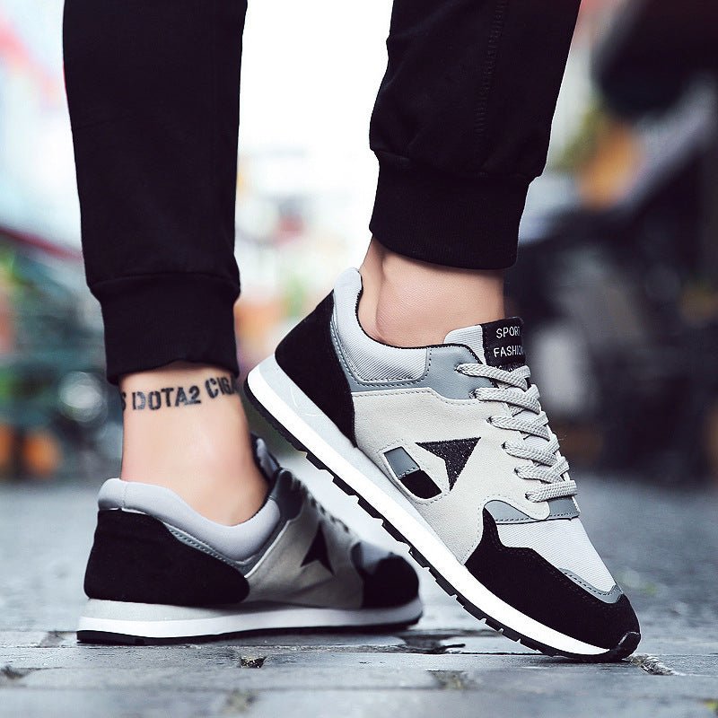 Trendy men's breathable sport casual running sneakers in black with white accents, featuring cushioned soles and mesh upper.