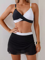 Women's two-tone cami and skort swim set by Trendsi, stylish two-piece swimwear perfect for beach or poolside lounging.