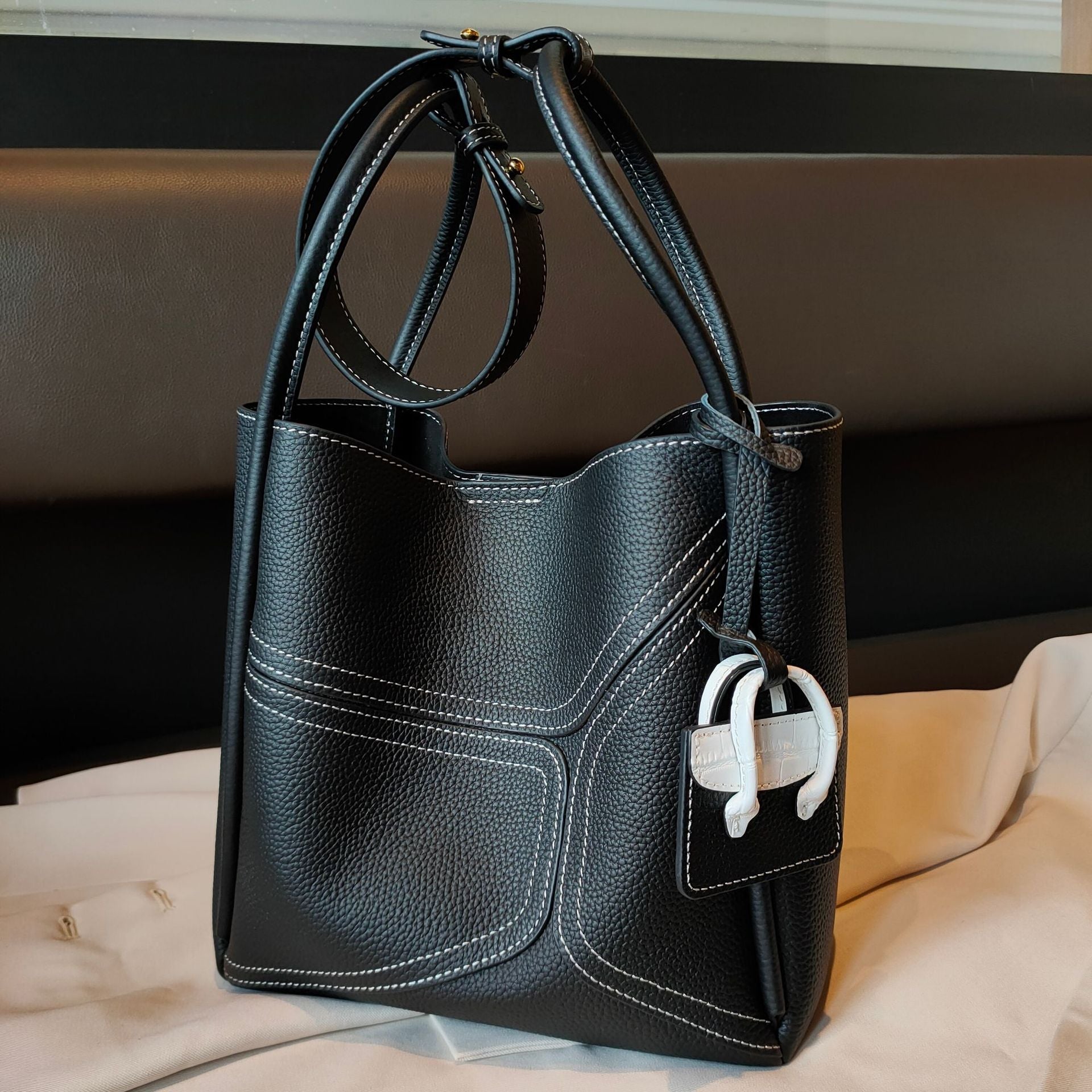 Contrast color basket-style LadyShow.Store underarm bag with shoulder strap, crossbody design, and stylish handbag appearance.