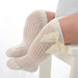 Baby Girls Long Bow SockWrap your little one's feet in soft cotton with our Baby Girls Long Bow Sock. These knee-highs feature a Spanish-inspired design with delicate lace detailing, perfecSocksPlush Fashions ShopPlush Fashion ShopBaby Girls Long Bow Sock