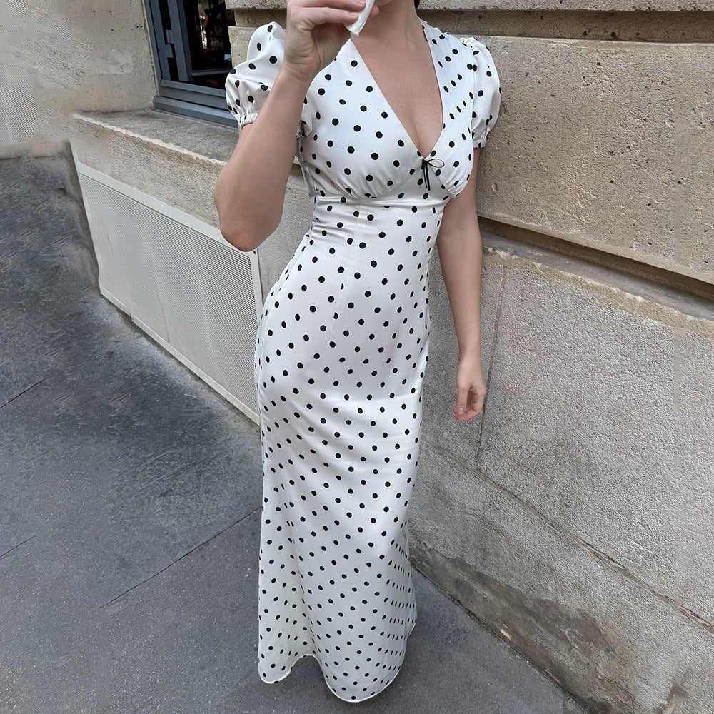 Elegant V-neck maxi dress by Bella Mia featuring puff sleeves, polka dots, lace-up waist, and a slim, sexy silhouette.