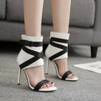 Pair of plush fashion hub women's summer peep-toe strappy high heels with block heels and open toe design.