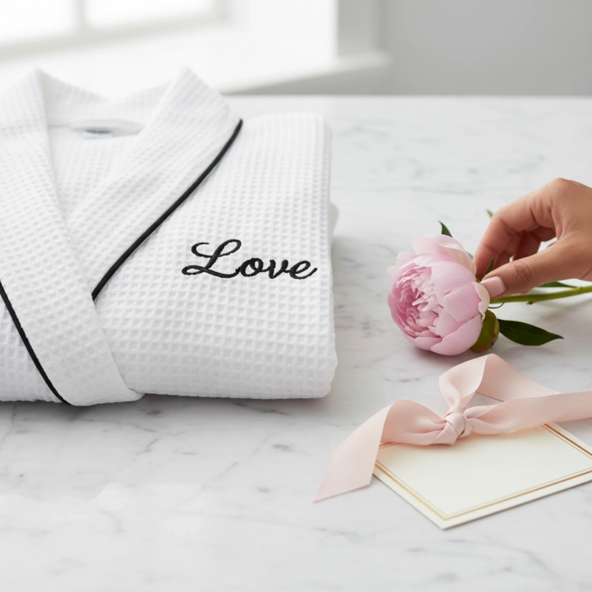 White women's waffle piping bathrobe from Lotus Linen, lightweight spa-style robe with soft, comfortable fabric for relaxing wear.