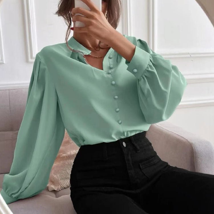 Elegant solid color women's shirt by Bella Mia with long sleeves, collar, button front, perfect for autumn wear.