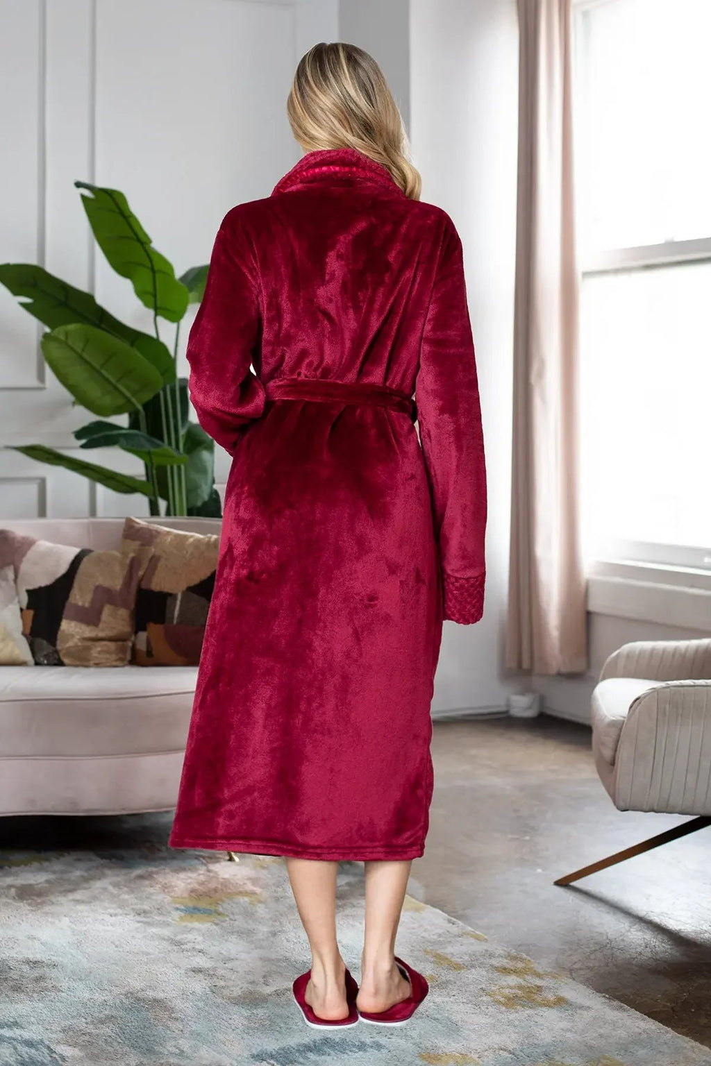 Women’s ultra-soft plush bathrobe by Lotus Linen, showing a cozy, light pink robe with a hood and belt for comfortable loungewear.