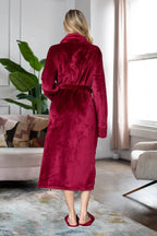 Women’s ultra-soft plush bathrobe by Lotus Linen, showing a cozy, light pink robe with a hood and belt for comfortable loungewear.