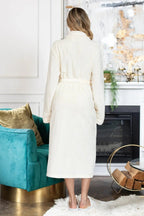 Women’s Lotus Linen ultra-soft plush bathrobe, cozy and plush, worn by a woman in a comfortable fit.