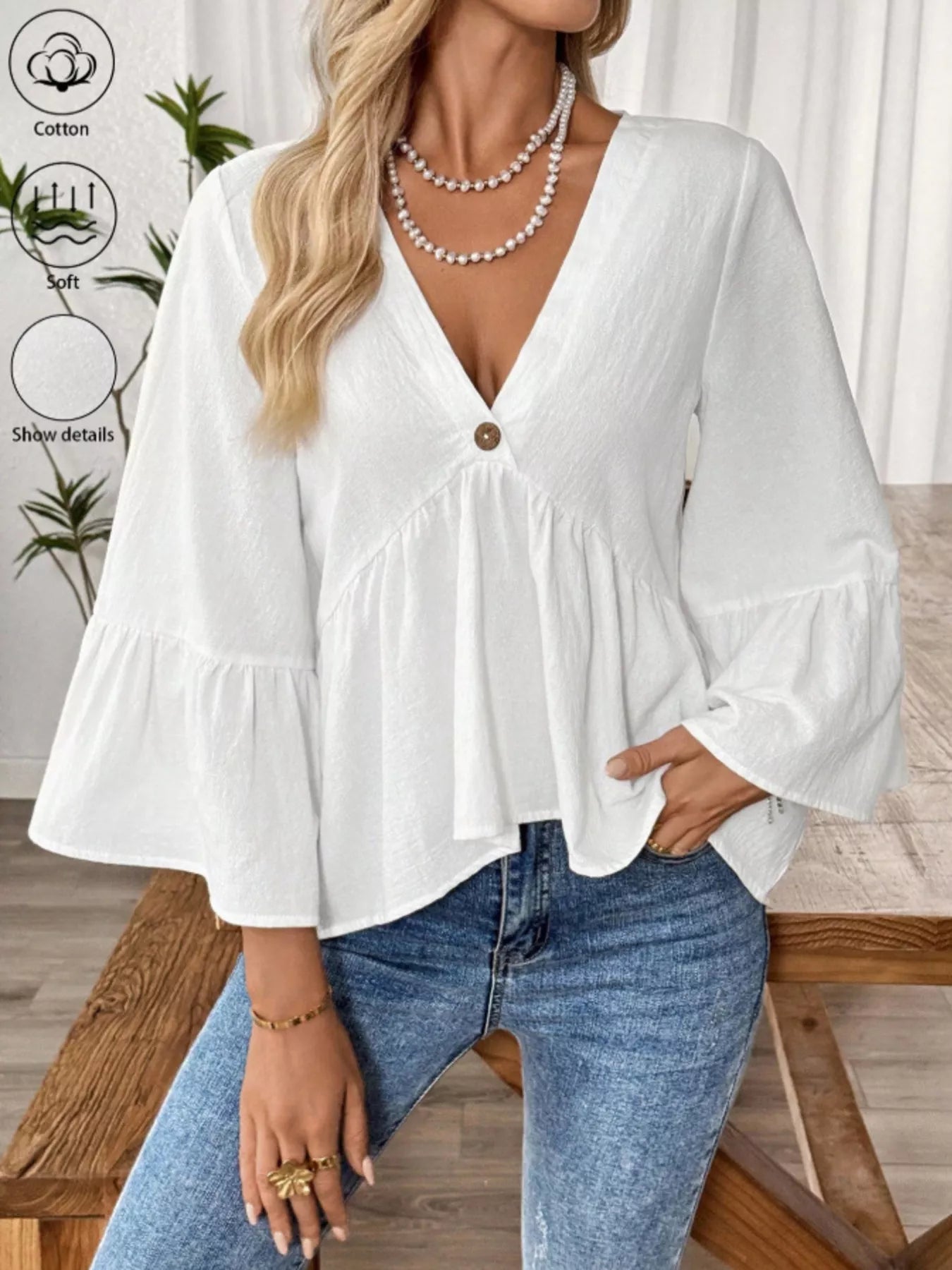 Women's cotton V-neck blouse with bell sleeves, stylish and comfortable, featuring a relaxed fit and effortless chic style.