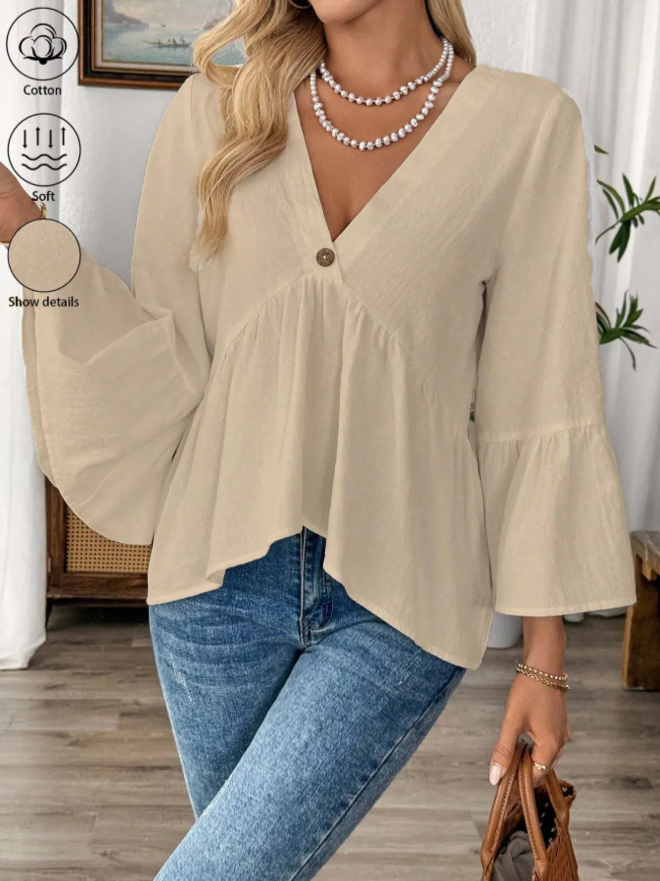 Women's 100% cotton V-neck bell sleeve blouse with a chic, effortless style, featuring a relaxed fit and stylish bell sleeves.