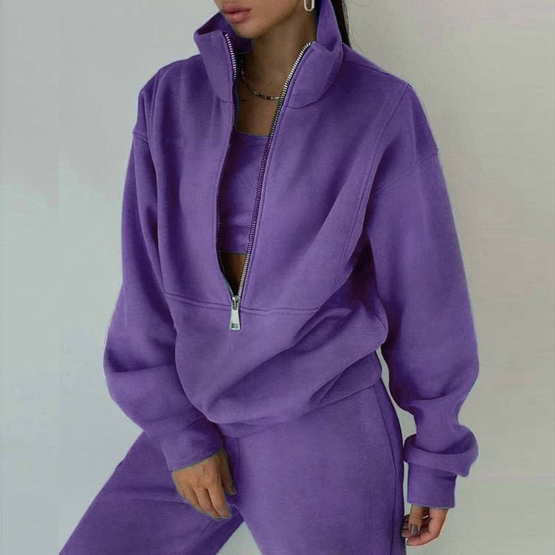 Women's casualwear set by FitiqueFit featuring a zip neck long sleeve sweatshirt and slim fit pants.