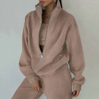 Women's casualwear 2-piece zip neck long sleeve sweatshirt and slim fit pants set by FitiqueFit, shown in a relaxed, stylish fit.