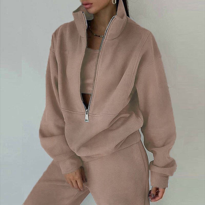 Women's casualwear 2-piece zip neck long sleeve sweatshirt and slim fit pants set by FitiqueFit, shown in a relaxed, stylish fit.