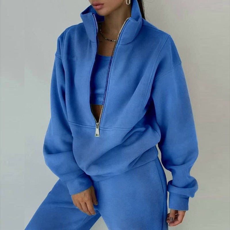 Women's 2-piece zip neck long sleeve sweatshirt and slim fit pants casualwear set by FitiqueFit, shown in a comfortable, stylish fit.