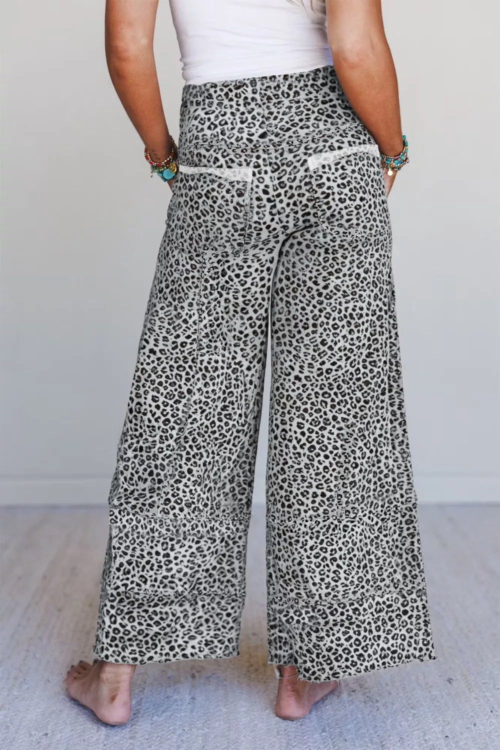 Women's animal print wide-leg terry knit pants with drawstring waist, stylish and comfortable for casual wear.