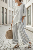 Women's beach vacation two-piece set by FitiqueFit, featuring a loose, casual summer outfit with a sleeveless top and shorts.