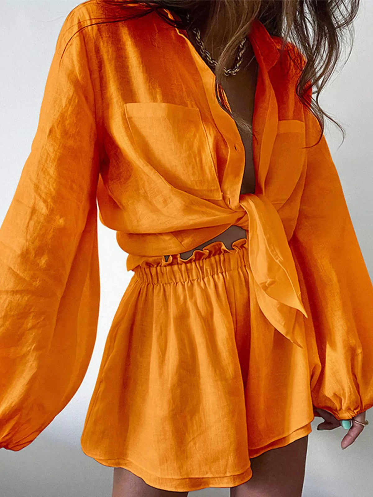 Women’s button-up long sleeve shirt and shorts two-piece lounge set by Plush Fashion Hub, casual and comfortable clothing set.