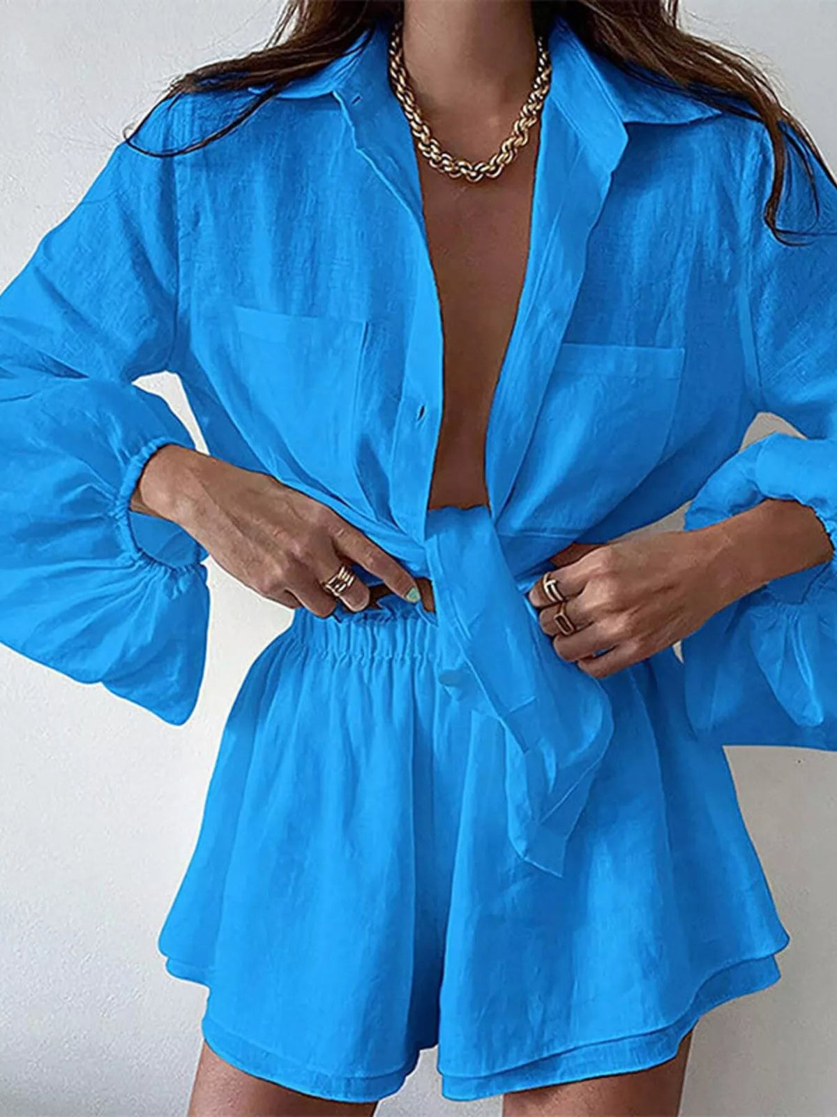 Women’s button-up long sleeve shirt and shorts two-piece lounge set by Plush Fashion Hub, displayed flat on a white background.