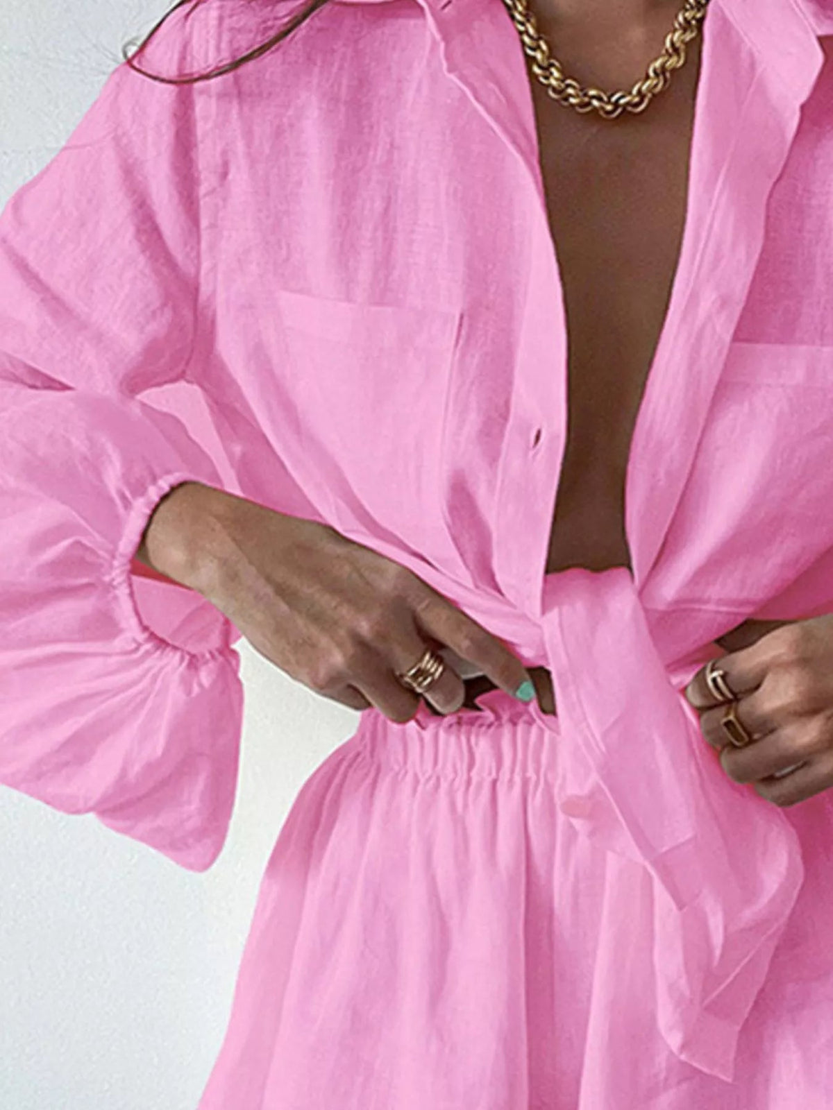 Women’s long sleeve button-up shirt and shorts two-piece lounge set by Plush Fashion Hub, soft fabric, casual style, perfect for relaxing.