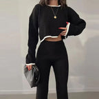Women’s casual color-block two-piece set by FitiqueFit, featuring a stylish top and matching pants in vibrant color blocks.