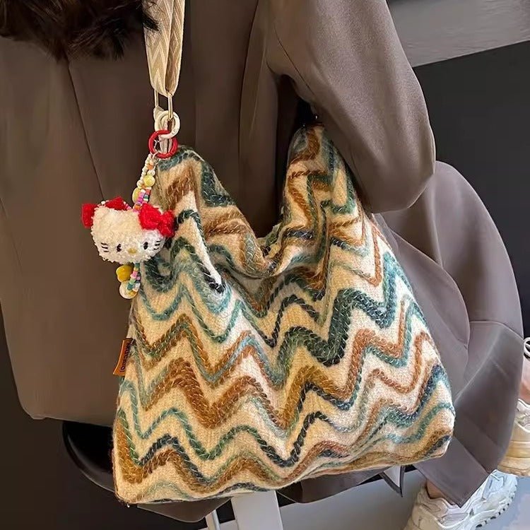 Embroidered ethnic-style women's casual crossbody shoulder bag with colorful patterns and leather strap.