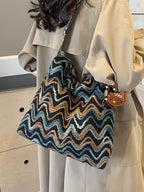 Women's casual ethnic-style embroidered crossbody shoulder bag with colorful detailing and adjustable strap.