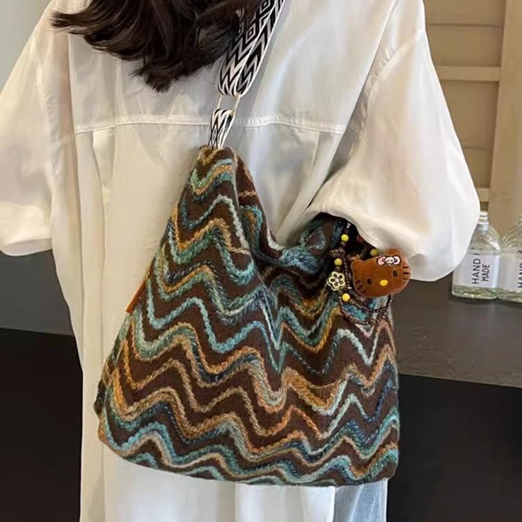 Embroidered ethnic-style crossbody shoulder bag for women, featuring casual design and intricate embroidery details.