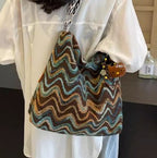 Embroidered ethnic-style crossbody shoulder bag for women with colorful patterns and casual design.