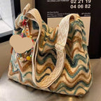 Women's casual ethnic-style embroidered crossbody shoulder bag, featuring colorful patterns and intricate embroidery.
