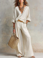 Women's casual linen vacation set by FitiqueFit, featuring a three-quarter sleeve top and full-length pants, perfect for relaxed wear.
