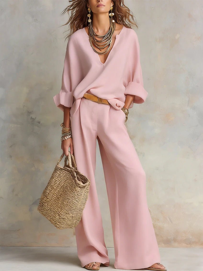 Women's casual linen vacation set by FitiqueFit, featuring a three-quarter sleeve top and full-length pants in a relaxed style.