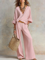 Women's casual linen vacation set by FitiqueFit, featuring a three-quarter sleeve top and full-length pants in a relaxed style.