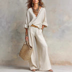 Women's casual linen vacation set with three-quarter sleeve top and full-length pants by FitiqueFit, perfect for relaxed summer days.