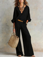 Women's casual linen vacation set from FitiqueFit with three-quarter sleeve top and full-length pants, ideal for relaxed summer wear.