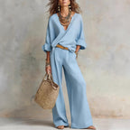 Women's casual linen vacation set by FitiqueFit, featuring a three-quarter sleeve top and full-length pants in a relaxed style.