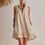 Women's casual loose sleeveless dress with half-zip front and ruffle hem by FitiqueFit, shown on a model.