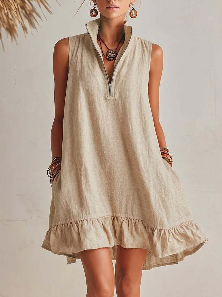 Women's casual loose sleeveless half-zip dress with ruffle hem by FitiqueFit, showing the relaxed fit and stylish ruffle details.