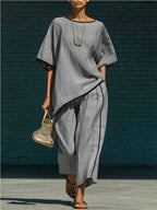 Women's casual resort loose short-sleeve top and pants set by FitiqueFit, featuring relaxed fit and comfortable fabric.