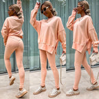 Women’s casual sweater suit by FitiqueFit featuring a loose split top and fitted trousers, perfect for relaxed everyday wear.