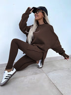 Women’s casual sweater suit by FitiqueFit featuring a loose split top and fitted trousers, ideal for relaxed everyday wear.