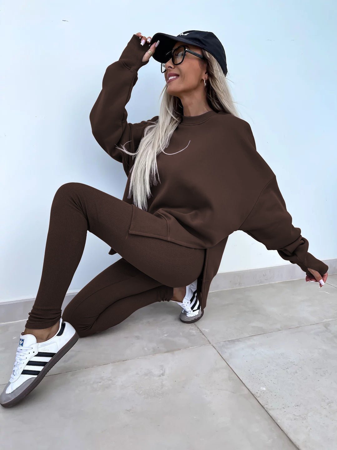Women’s casual sweater suit by FitiqueFit featuring a loose split top and fitted trousers, ideal for relaxed everyday wear.