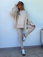 FitiqueFit women's casual sweater suit with a loose split top and fitted trousers, perfect for relaxed, stylish everyday wear.