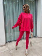 Women’s casual sweater suit by FitiqueFit featuring a loose split top and fitted trousers, ideal for comfortable everyday wear.
