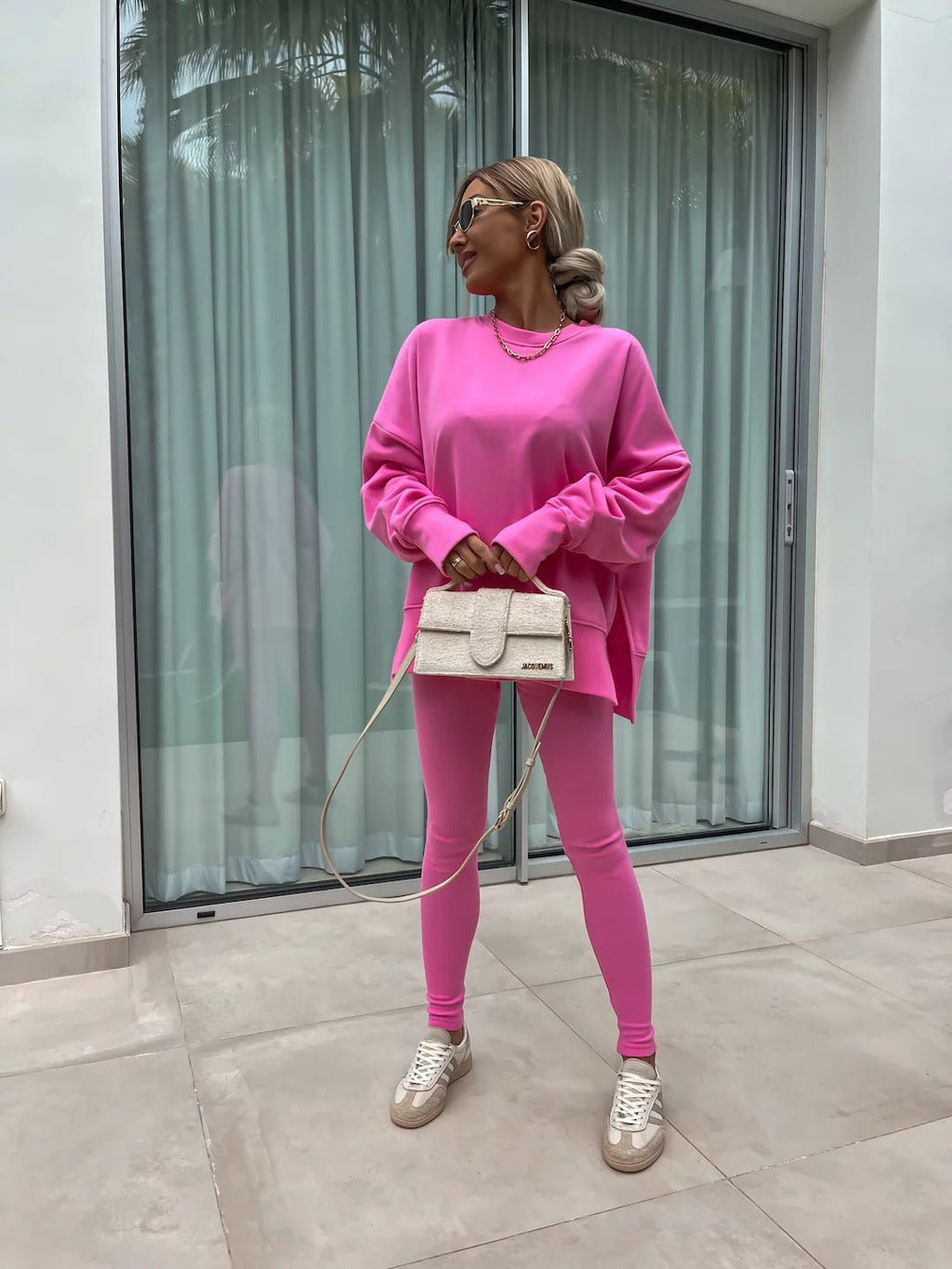 Women’s casual sweater suit by FitiqueFit featuring a loose split top and fitted trousers, perfect for comfortable everyday wear.